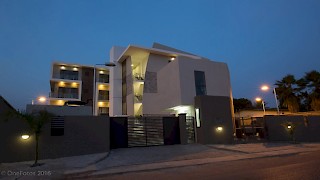 Devtraco Plus Ghana Limited Avant Garde night view with front gate